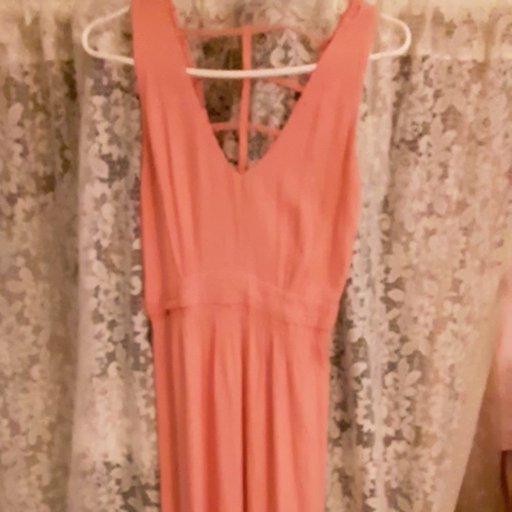 Peach color dress.